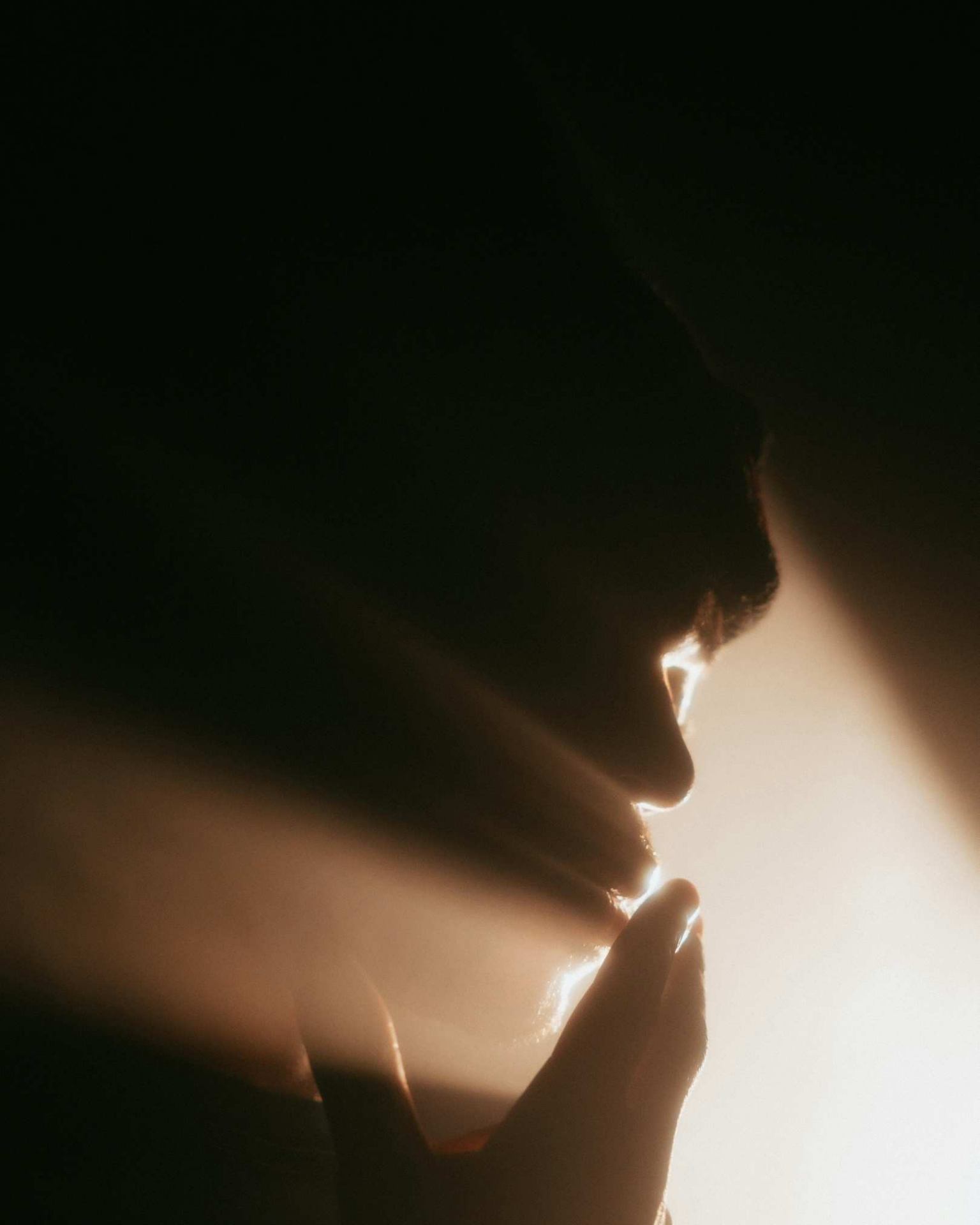 A soul in prayer, kissed by light